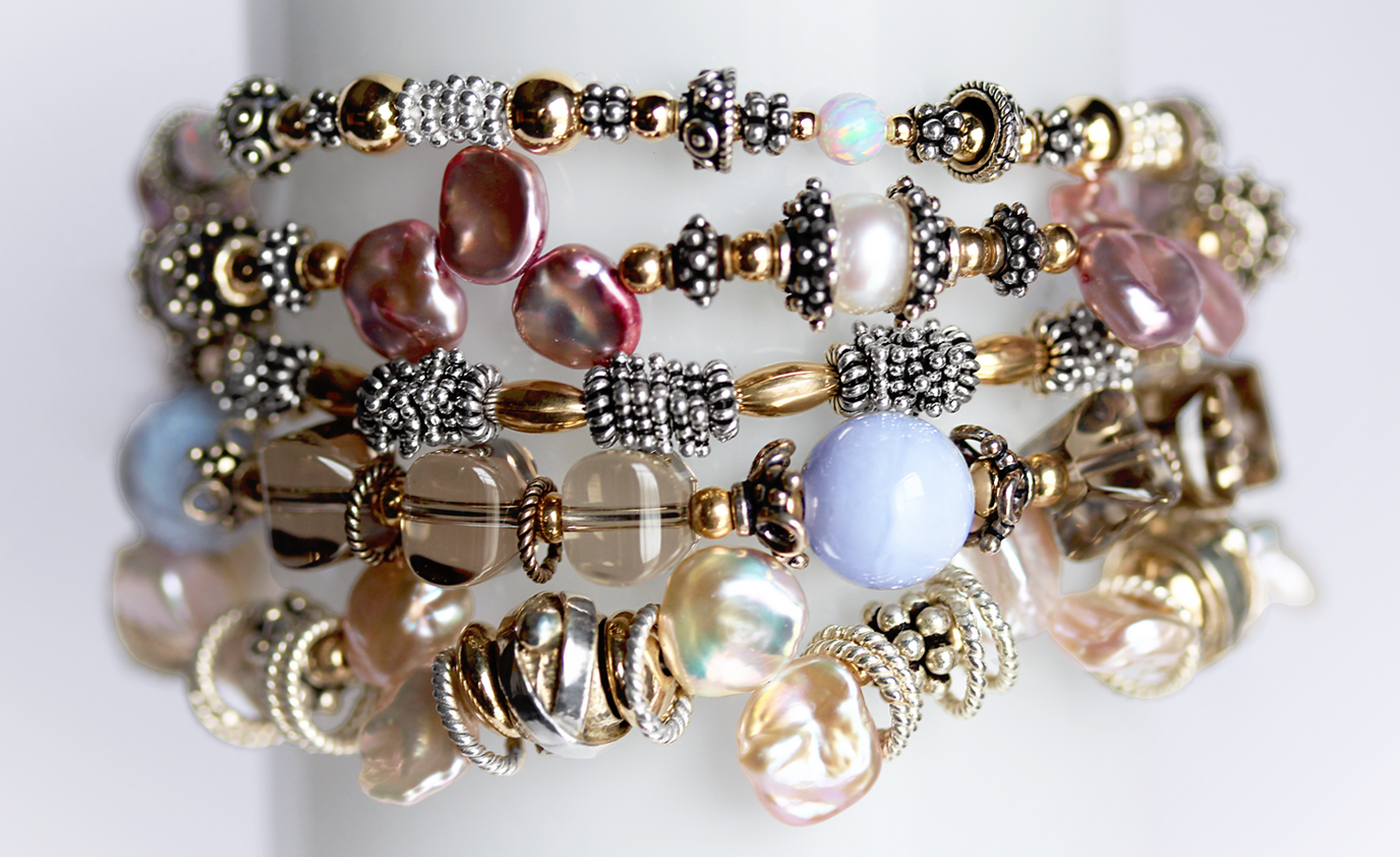 Stylish bracelet stack with sterling silver beads, accented by 14k gold, glowing opals, smoky quartz, agate, and unique pearls.