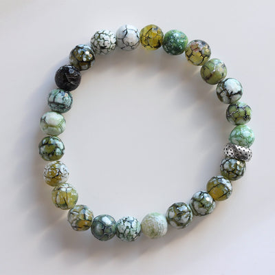 6mm Dragon Vein Agate Stretch Bracelet casting shadows in the sunlight. 