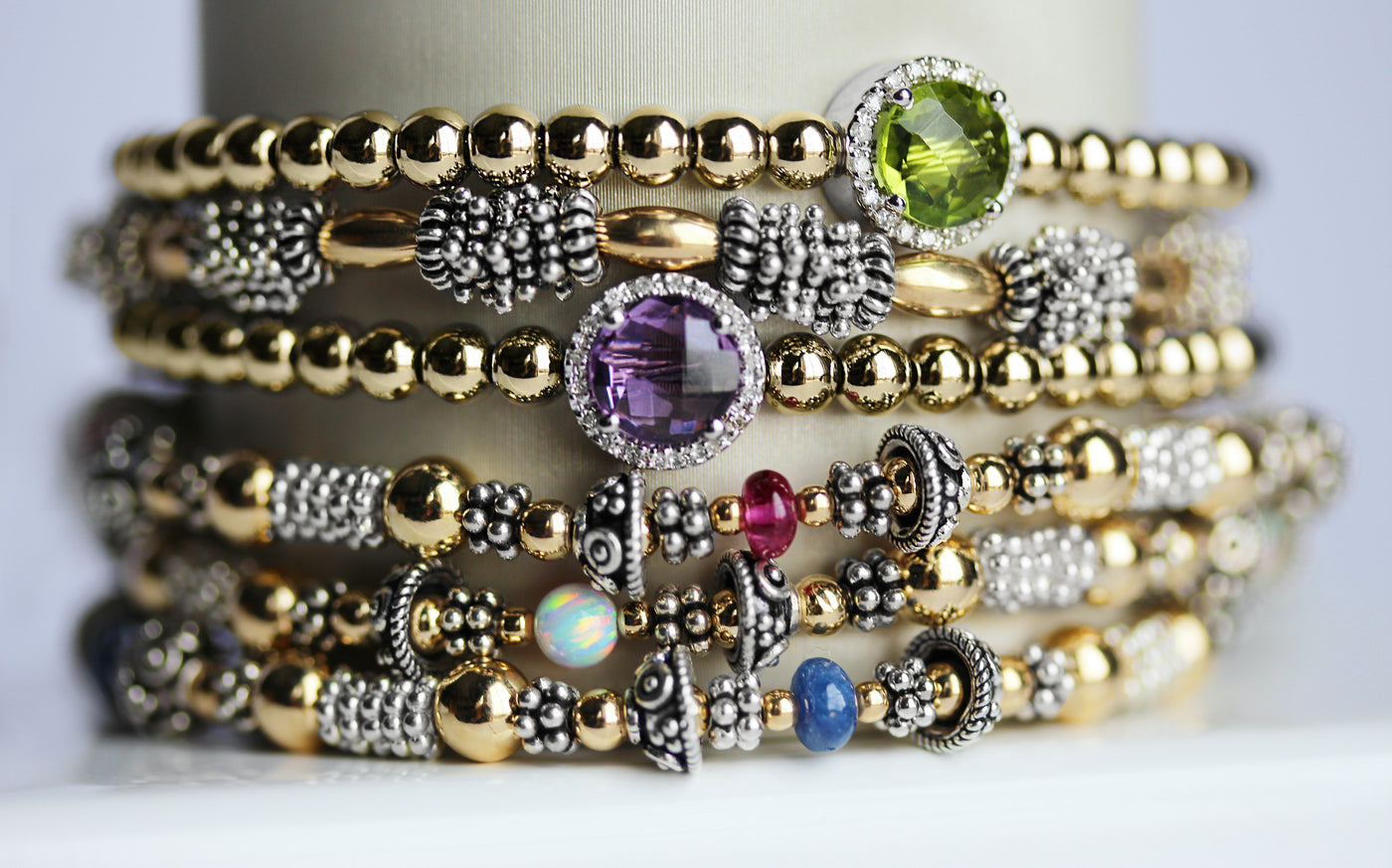 Stack of sparkling birthstone bracelets
