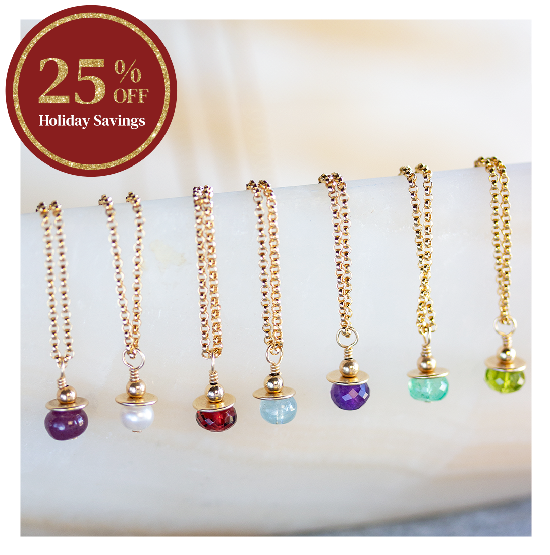 Elisa Ilana birthstone necklaces featuring colorful gemstone charms on gold chains, displayed with a 25% off Holiday Savings badge. Elegant personalized jewelry perfect for holiday gifting.