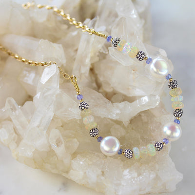 Elisa Ilana Freshwater Coin Pearl & Ethiopian Opal necklace with luminous pearls and glowing opal beads accented by sterling silver and gold details, a radiant handcrafted design that shines with timeless elegance.