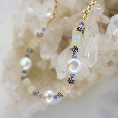 Elisa Ilana Freshwater Coin Pearl & Ethiopian Opal necklace with luminous pearls and glowing opal beads accented by sterling silver and gold details, a radiant handcrafted design that shines with timeless elegance.