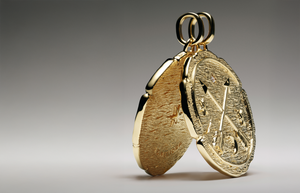 Gold medallion pendant from the Talisman Collection featuring textured detailing with crossed arrows, crescent moon, stars, and symbolic engravings — bold, artisanal jewelry piece designed to inspire meaning and personal storytelling.