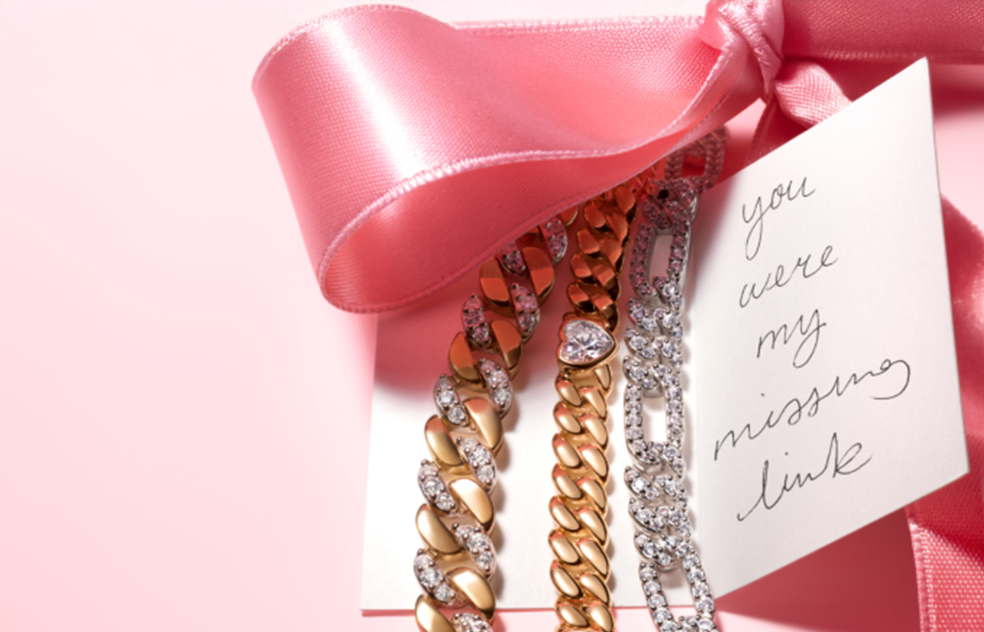Pandora gold and pavé link bracelets styled with a pink satin ribbon and handwritten gift tag reading 'you were my missing link' — romantic Pandora jewelry perfect for gifting and special occasions.