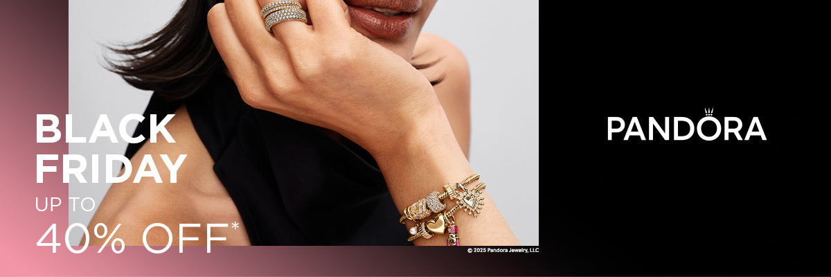 Pandora Black Friday promo showcasing a woman wearing stacked pavé rings and a gold charm bracelet with heart, star, and sparkling charms — featuring text 'Black Friday Up to 40% Off' on a bold gradient background.