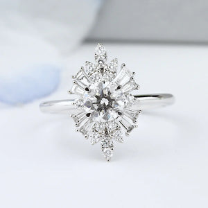 Close-up shot of a Parade Trillion & Round Diamond Halo Engagement Ring, showcasing its sparkling and radiant design.