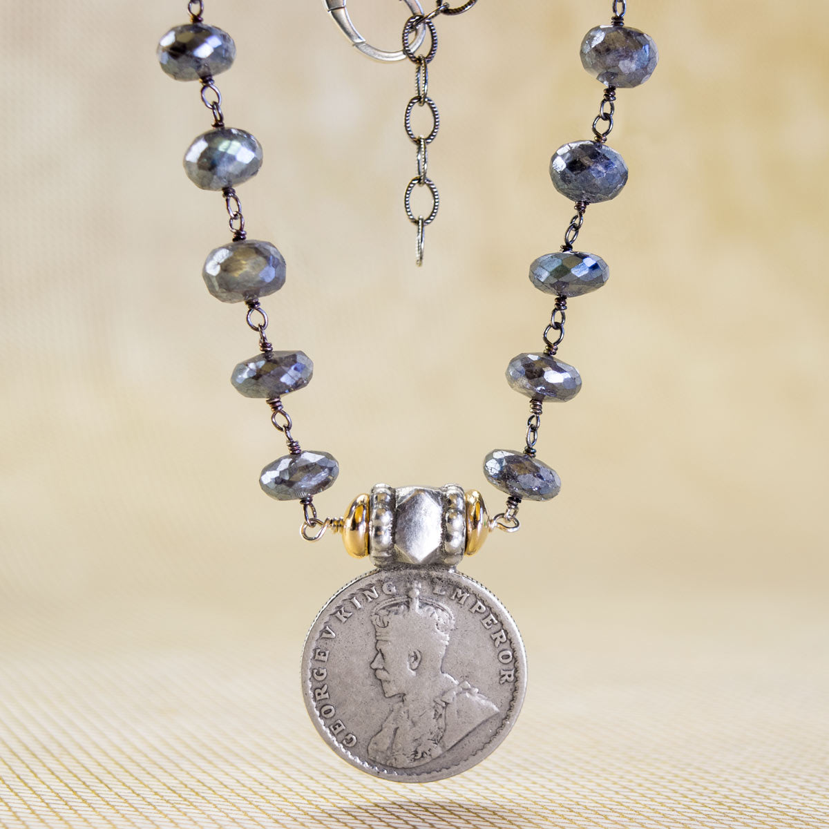 Half Rupee from India on Black Rhodium with Coated Labradorite