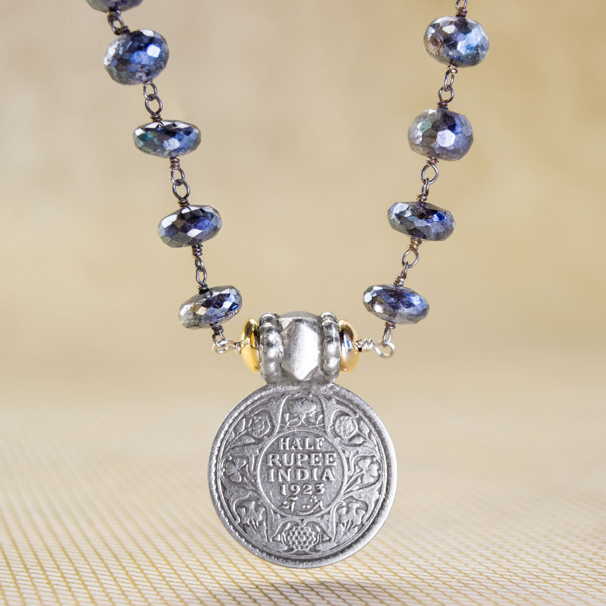 Half Rupee from India on Black Rhodium with Coated Labradorite